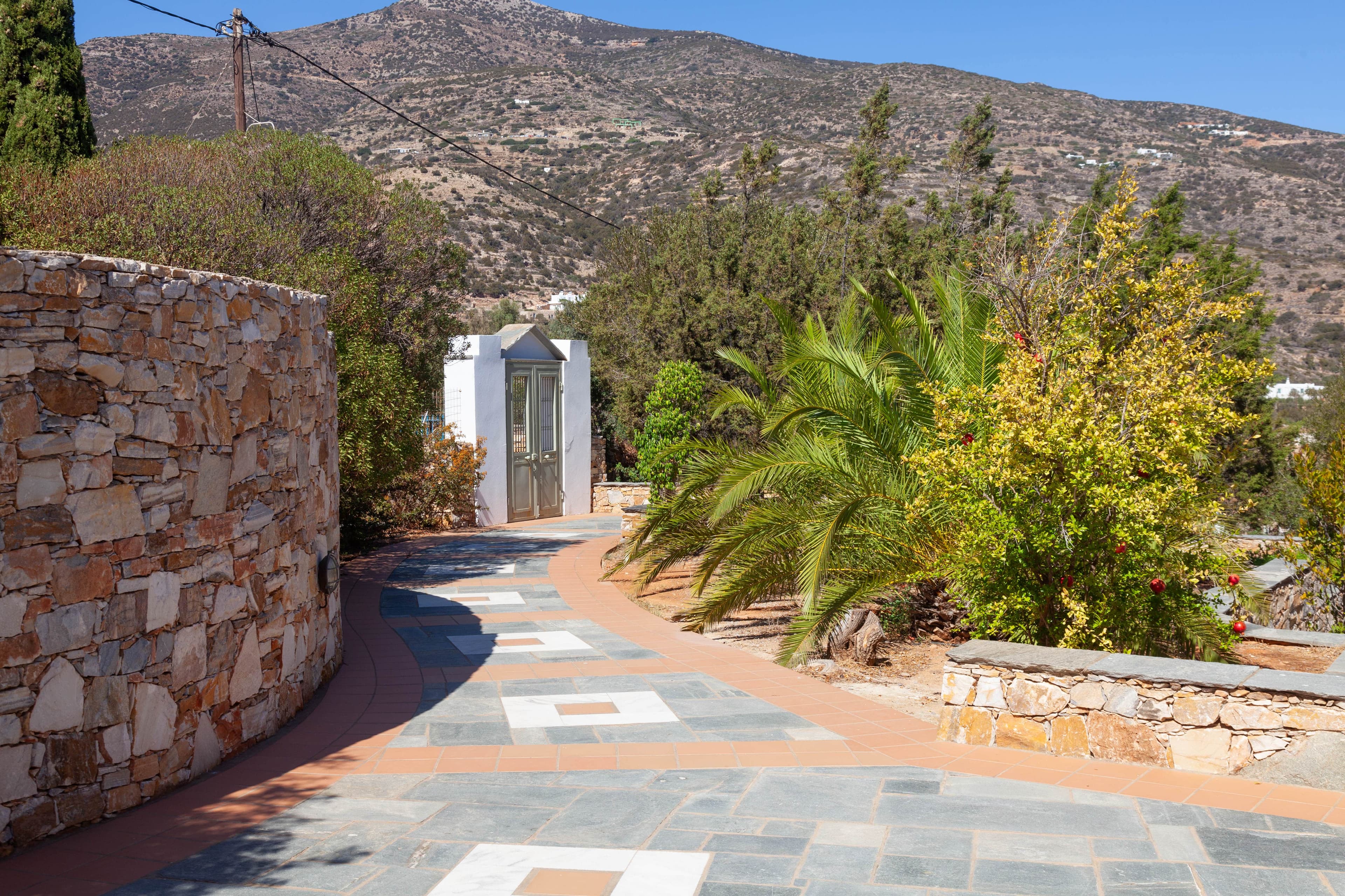 The paved path through the back garden to the gate