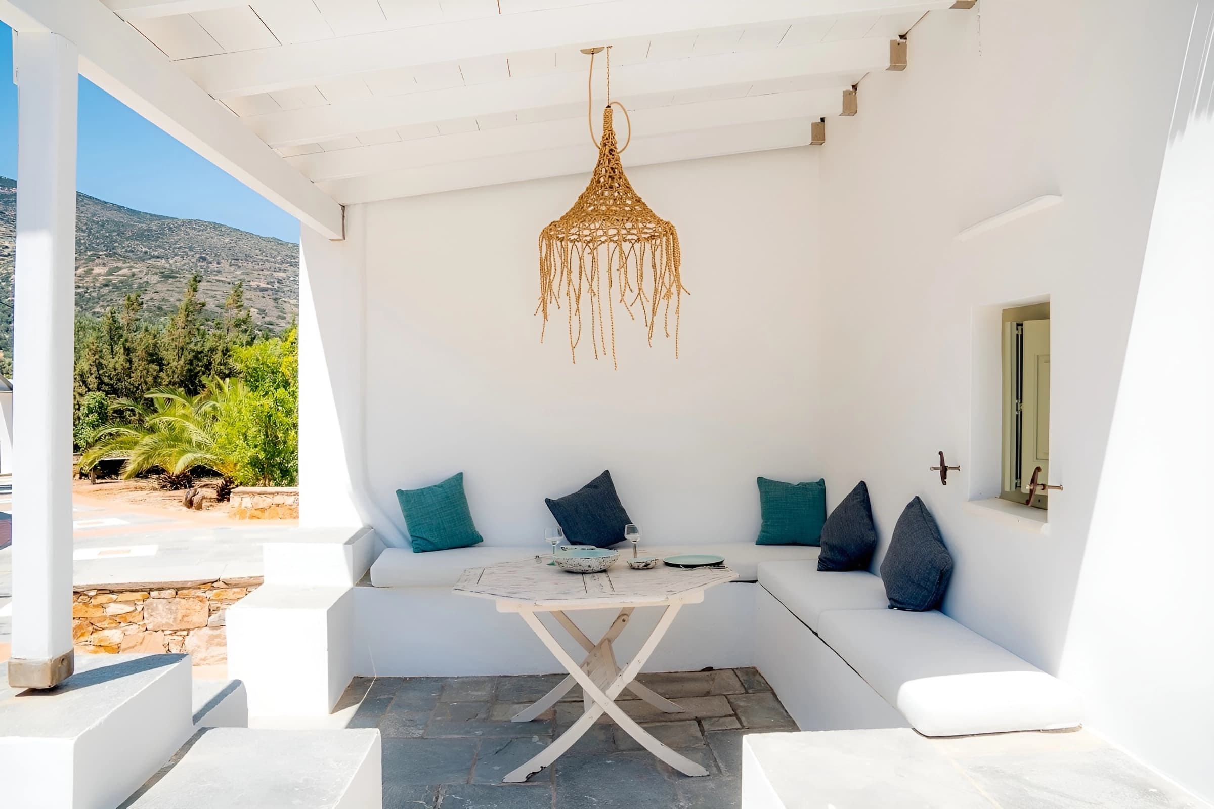 The pool dining area, benches built around the table