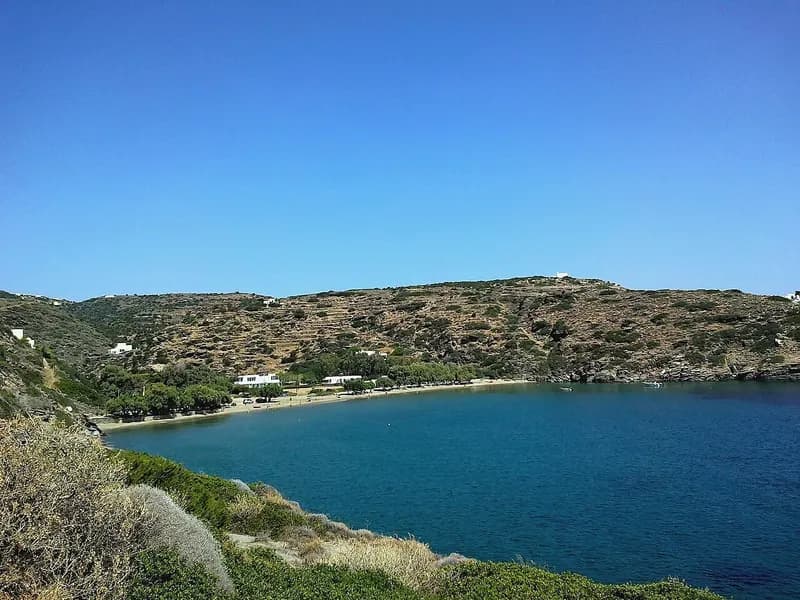 Apokofto beach beside Chrysopigi, Sifnos: sand, tamarisk shade and the headland beyond