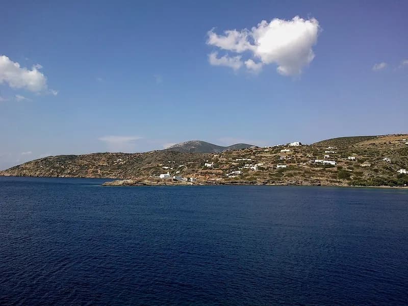 Fasolou cove east of Faros, Sifnos, with the white walls of the Stavros monastery above the water