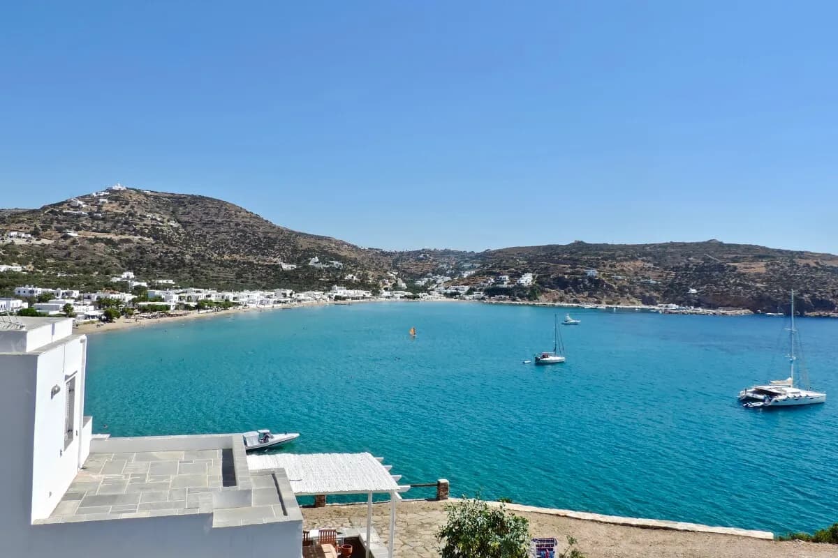 The long sandy beach of Platis Gialos, Sifnos, lined with tavernas